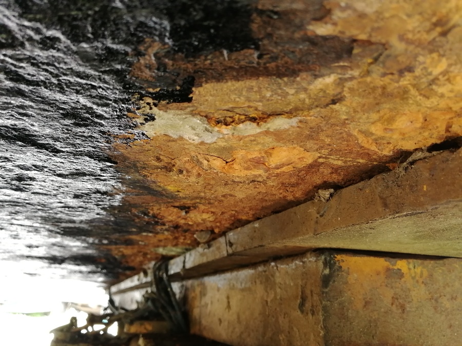 Image of the baseplate after blacking at the location of the supports holding up the boat. Note the rust compared to the smoother (blacker!) keelblack.